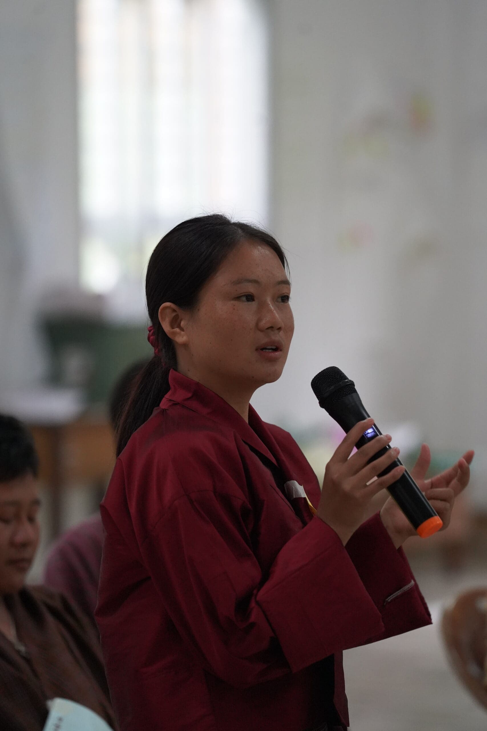This image is a women pitching about her business idea during bootcamp