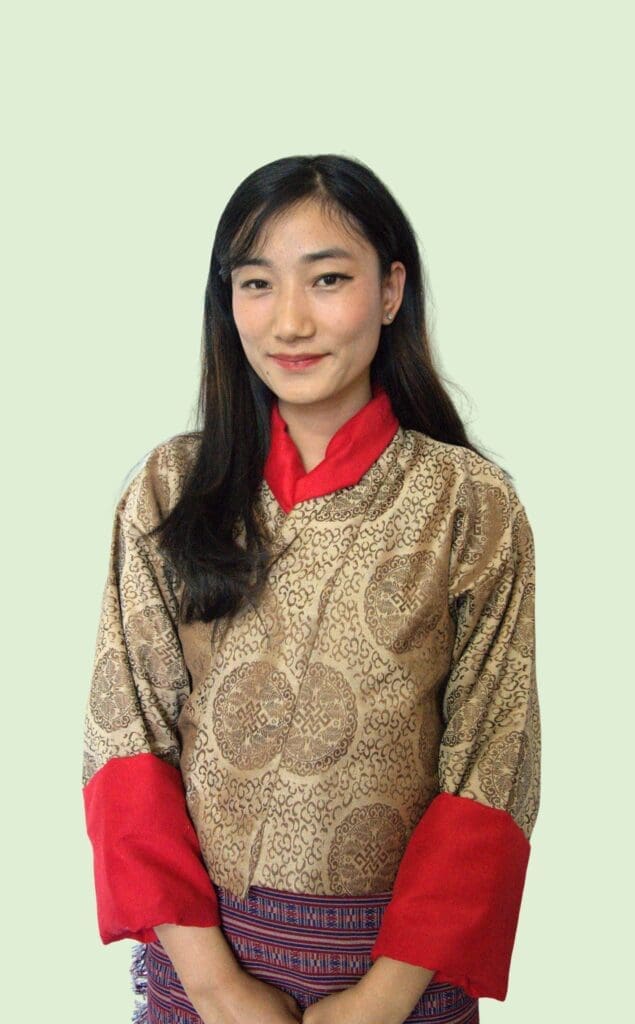 A women wearing beautiful Brown Kira is Assistant Accountant of Impact Hub Thimphu