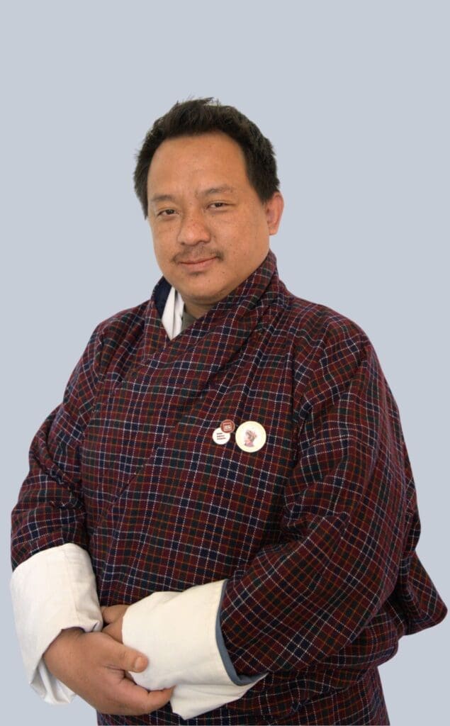 Profile Image a man wearing gho(Bhutanese Male Dress), co-founder of Impact Hub Thimphu